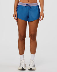 Woman wearing Accelerate 3" Mid-Rise Running Short - Electric Indigo-Multi | Set:true | Angle:front | Model:Brylee | Size:XS