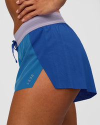 Woman wearing Accelerate 3" Mid-Rise Running Short - Electric Indigo-Multi | Model:Brylee | Size:XS