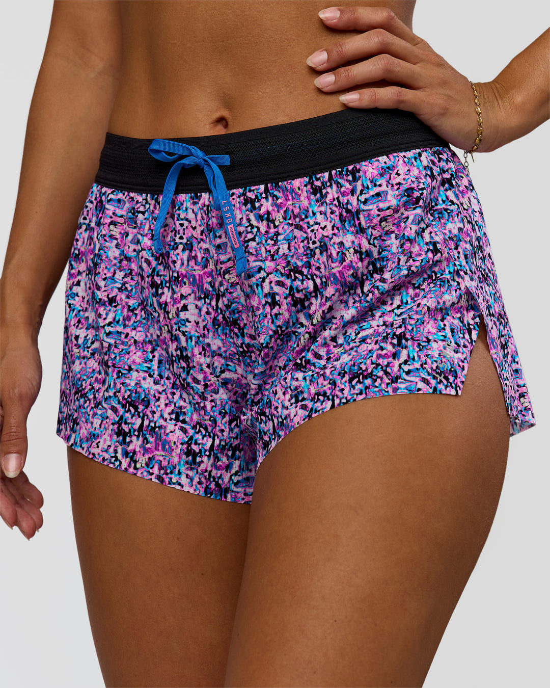 Woman wearing Accelerate 3" Mid-Rise Running Short in Energy Print Blue Multi | Model:Brylee | Size:XS