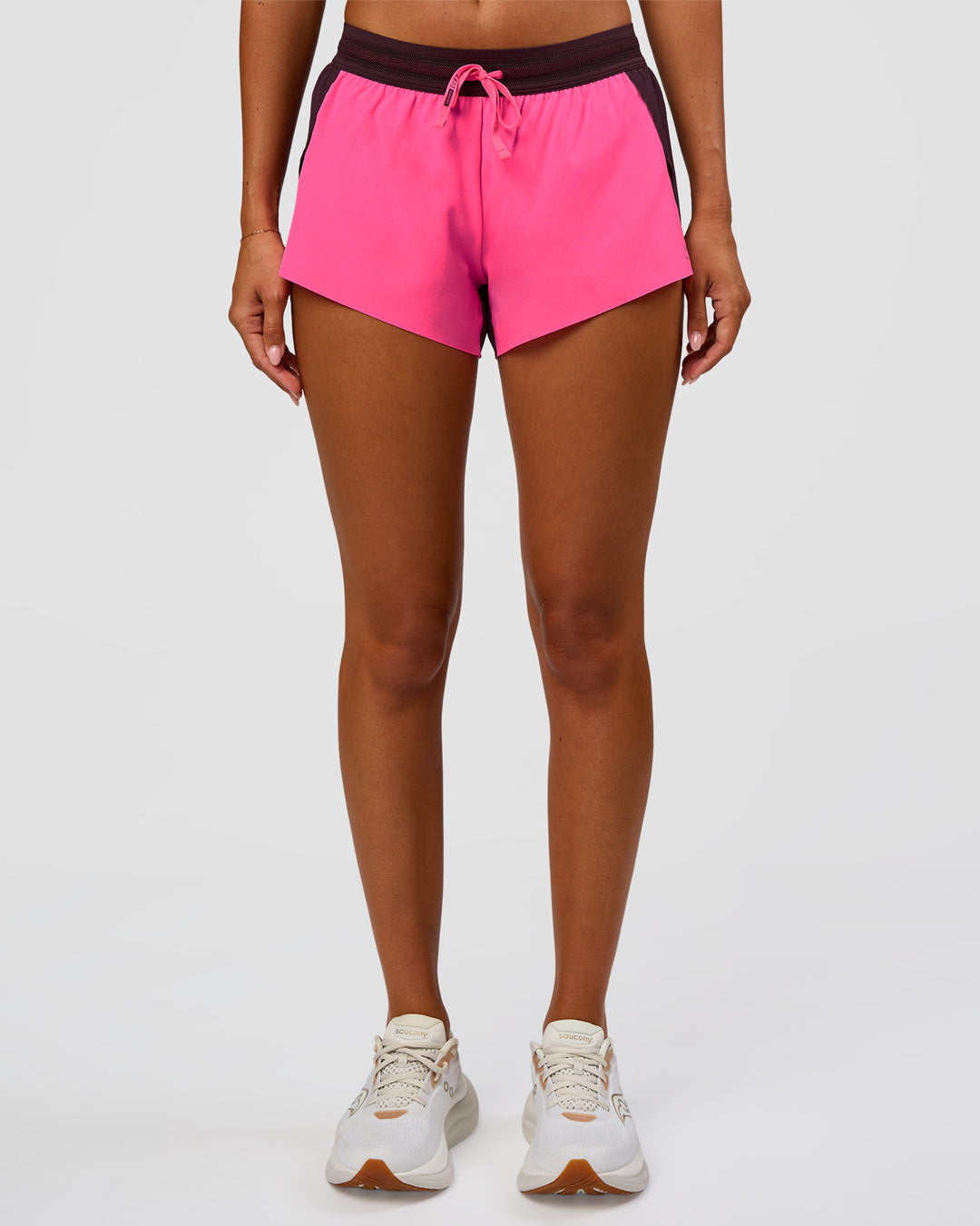 Woman wearing Accelerate 3" Mid-Rise Running Short - Midnight Plum-Sugar Plum | Set:True | Angle:front | Model:Charli | Size:XS