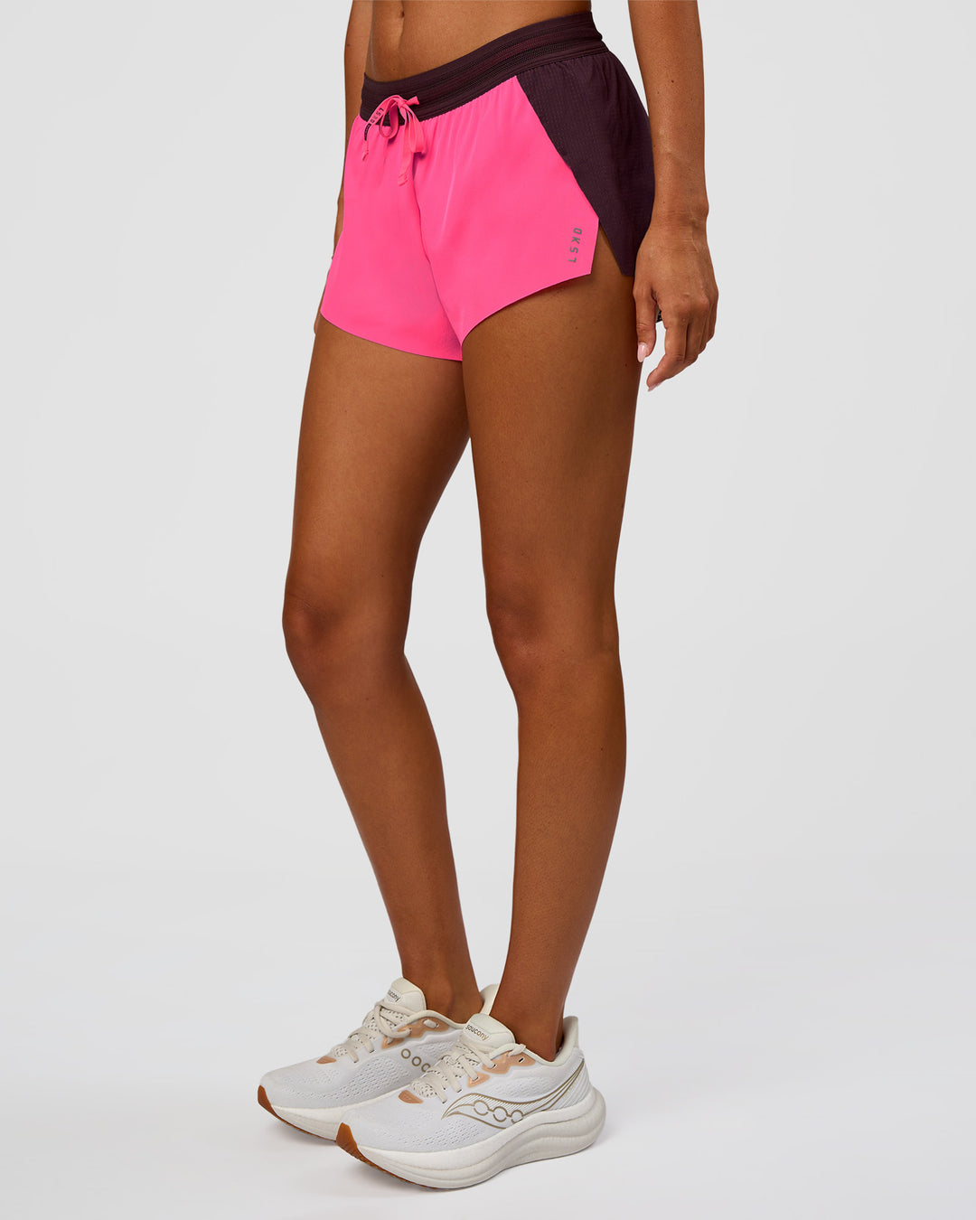 Woman wearing Accelerate 3" Mid-Rise Running Short - Midnight Plum-Sugar Plum | Set:True | Angle:side | Model:Charli | Size:XS