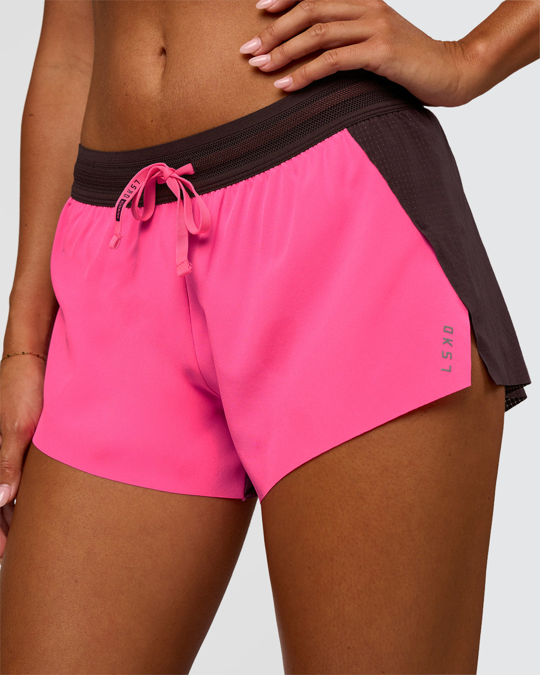Woman wearing Accelerate 3" Mid-Rise Running Short - Midnight Plum-Sugar Plum | Set:True | Angle:closeup | Model:Charli | Size:XS