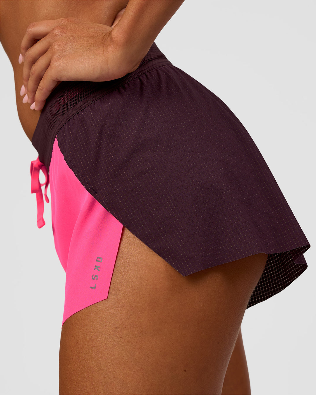 Woman wearing Accelerate 3" Mid-Rise Running Short - Midnight Plum-Sugar Plum | Model:Charli | Size:XS