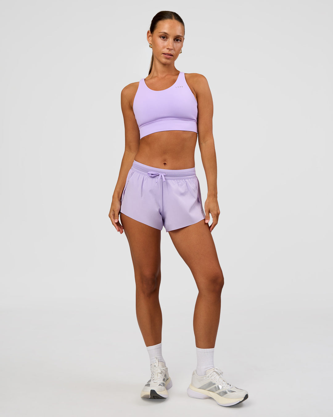 Woman wearing Accelerate 3" Mid-Rise Running Short - Pale Lilac | Model:Brylee | Size:XS