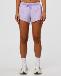 Woman wearing Accelerate 3" Mid-Rise Running Short - Pale Lilac | Set:true | Angle:front | Model:Brylee | Size:XS