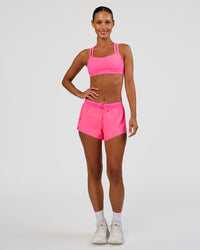 Woman wearing Accelerate 3" Mid-Rise Running Short - Sugar Plum | Model:Brylee | Size:XS