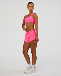 Woman wearing Accelerate 3" Mid-Rise Running Short - Sugar Plum | Model:Brylee | Size:XS