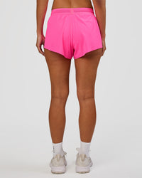 Woman wearing Accelerate 3" Mid-Rise Running Short - Sugar Plum | Set:true | Angle:back | Model:Brylee | Size:XS