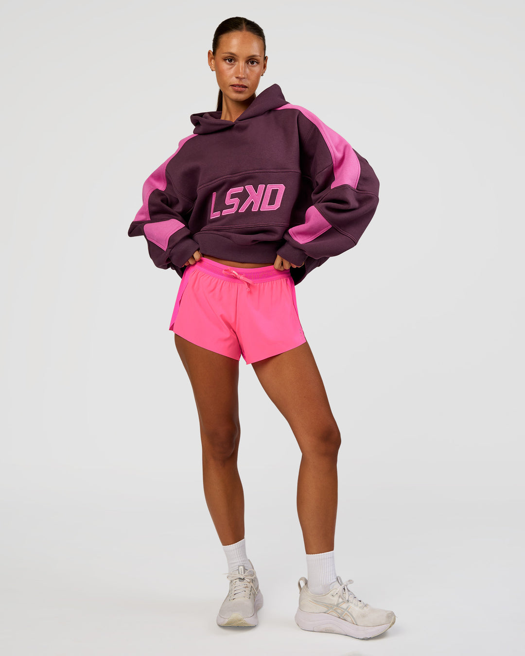Woman wearing Accelerate 3" Mid-Rise Running Short - Sugar Plum | Model:Brylee | Size:XS