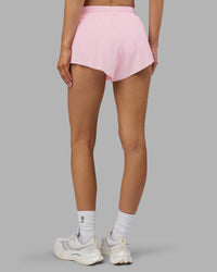 Woman wearing Accelerate 3" Running Short - Marshmallow-Candy Pink | Set:true | Angle:back | Model:Leilani | Size:XS