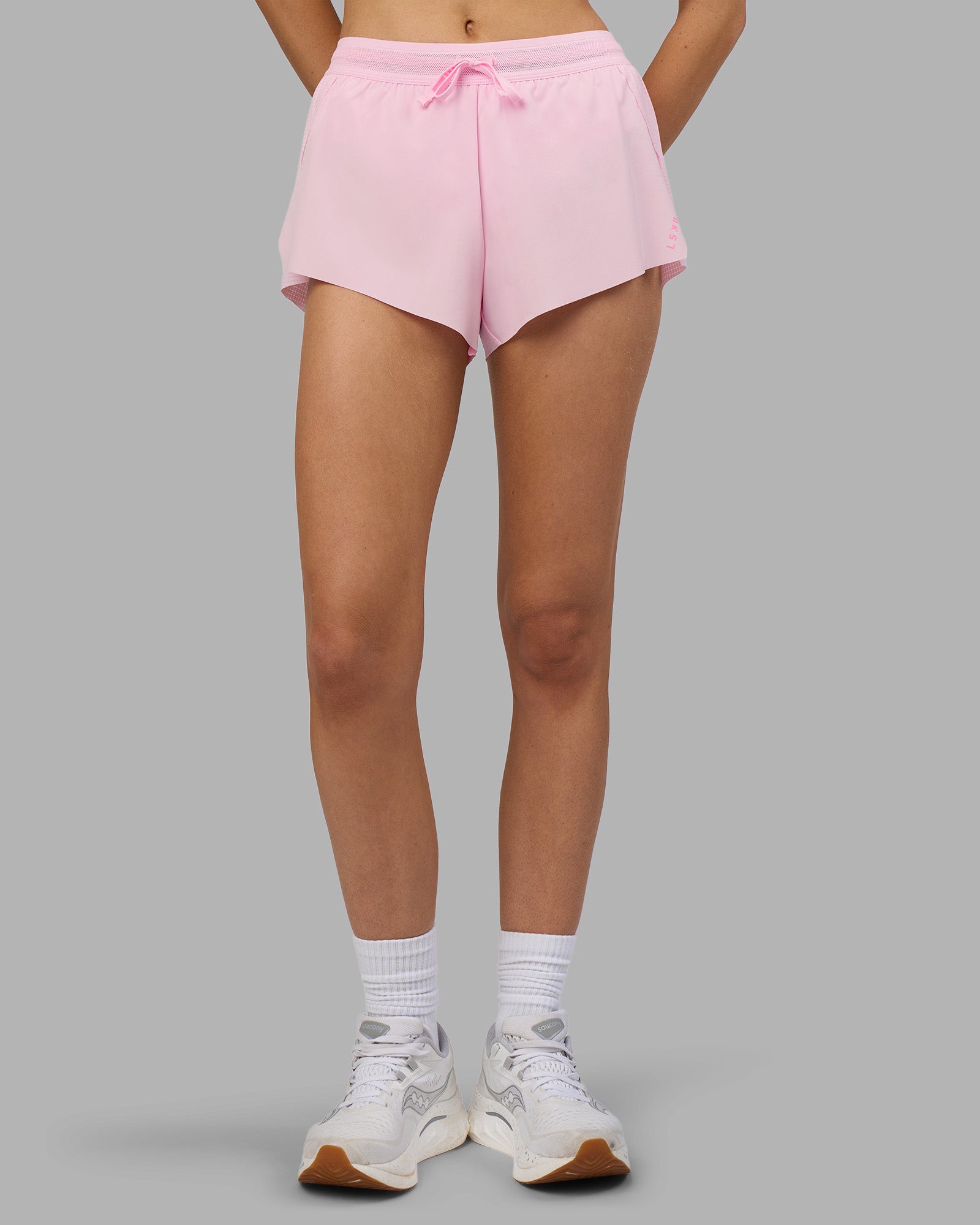 Woman wearing Accelerate 3" Running Short - Marshmallow-Candy Pink | Model:Leilani | Size:XS