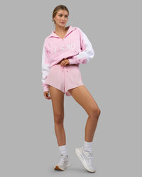 Woman wearing Accelerate 3" Running Short - Marshmallow-Candy Pink | Model:Leilani | Size:XS