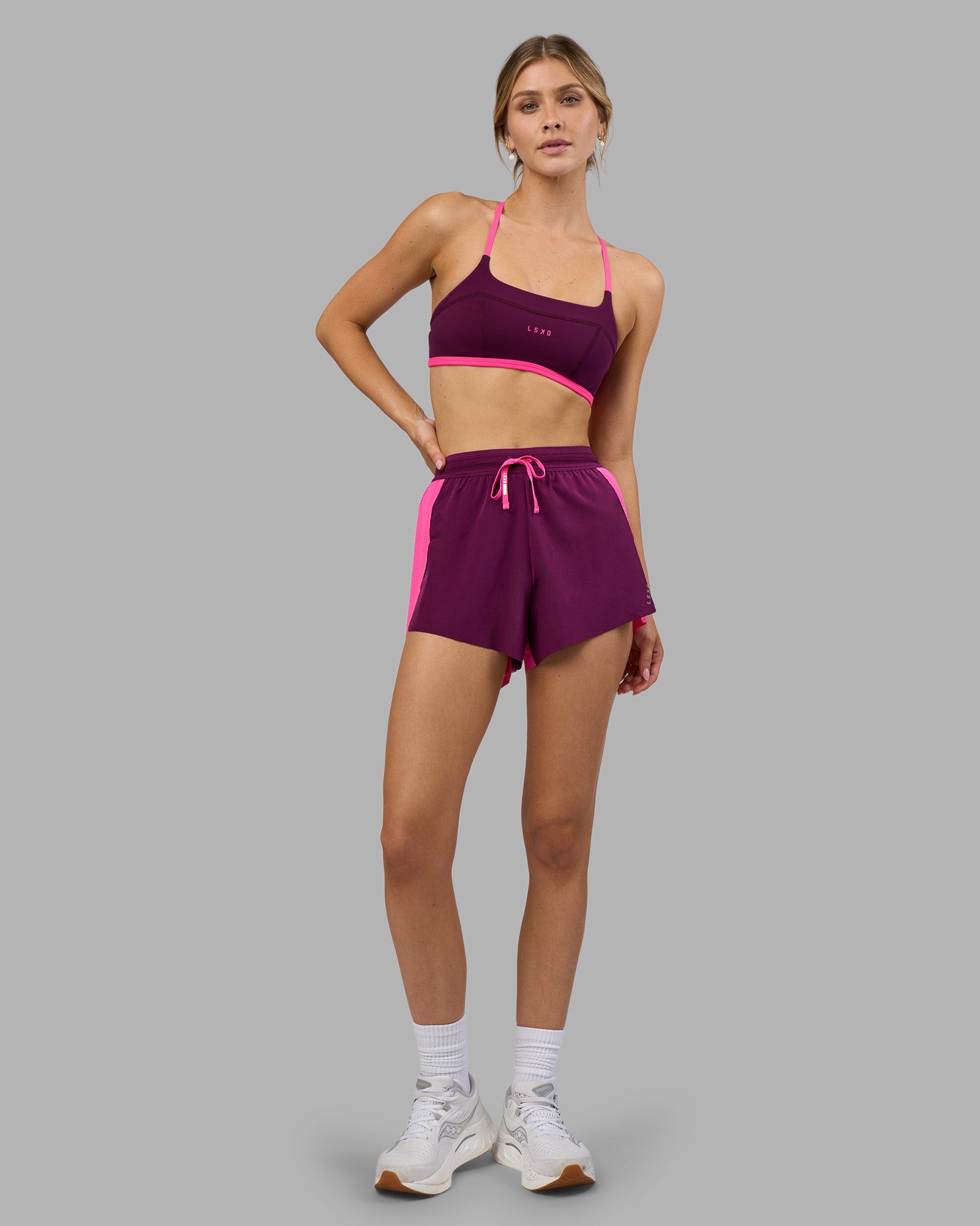 Woman wearing Accelerate 3" High-Rise Running Short - Ultra Pink-Plum Caspia | Model:Leilani | Size:XS