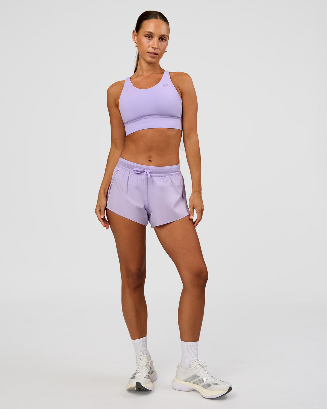Woman wearing Accelerate Split Strap Sports Bra - Pale Lilac | Model:Brylee | Size:XS