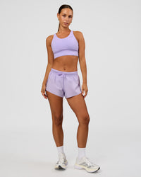 Woman wearing Accelerate Split Strap Sports Bra - Pale Lilac | Model:Brylee | Size:XS