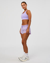 Woman wearing Accelerate Split Strap Sports Bra - Pale Lilac | Model:Brylee | Size:XS
