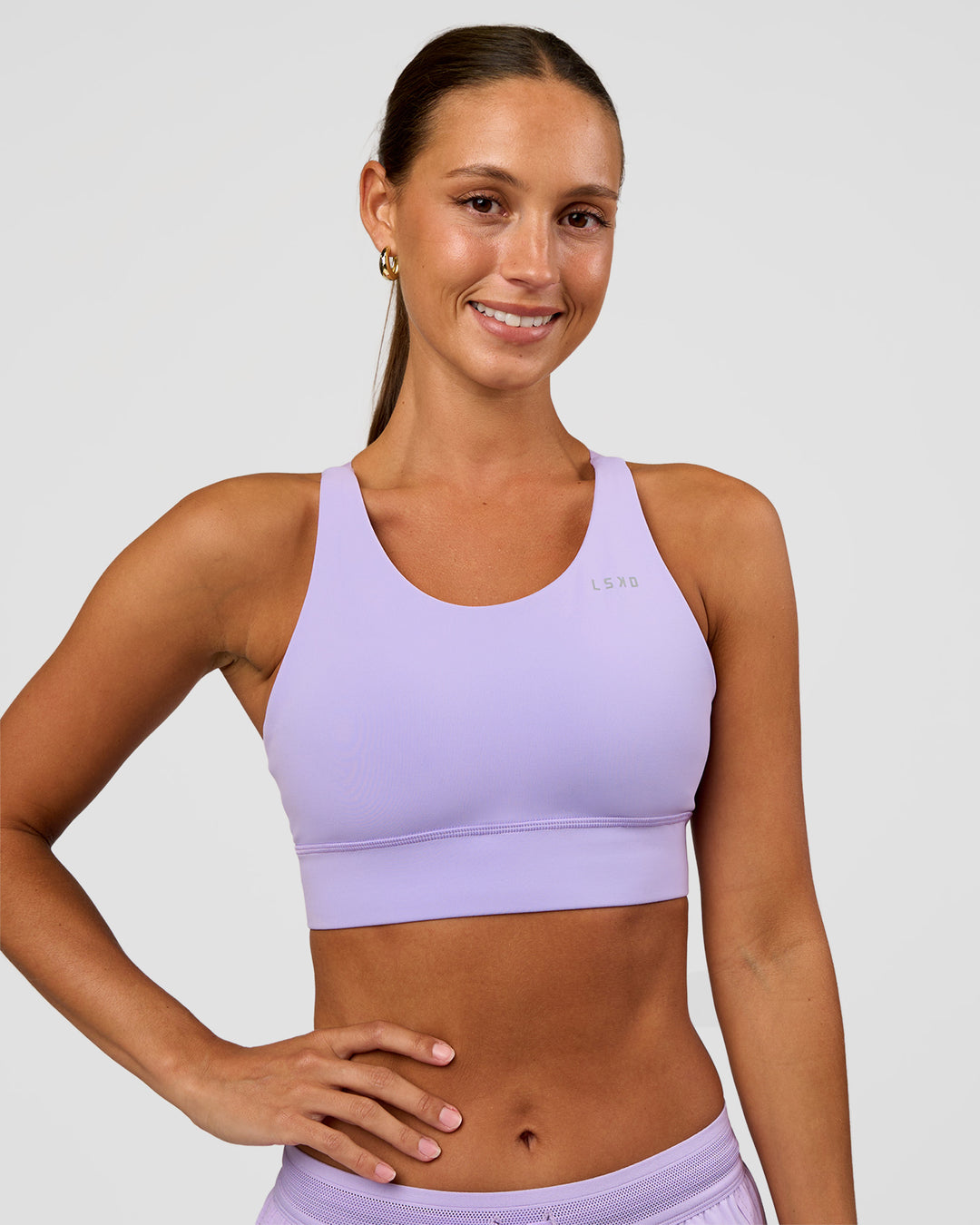 Woman wearing Accelerate Split Strap Sports Bra - Pale Lilac | Model:Brylee | Size:XS