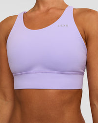 Woman wearing Accelerate Split Strap Sports Bra - Pale Lilac | Model:Brylee | Size:XS