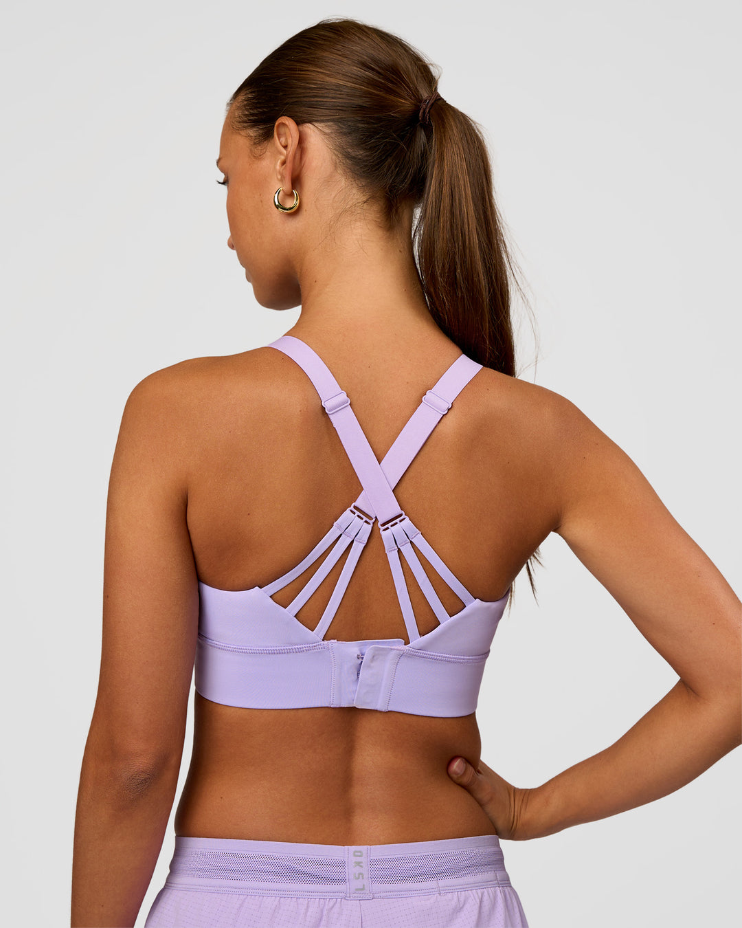Woman wearing Accelerate Split Strap Sports Bra - Pale Lilac | Model:Brylee | Size:XS