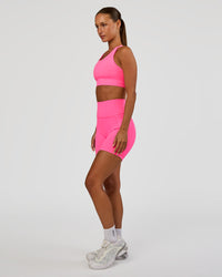 Woman wearing Accelerate Sports Bra - Sugar Plum | Model:Brylee | Size:XS