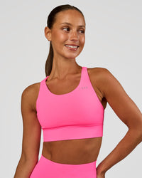 Woman wearing Accelerate Sports Bra - Sugar Plum | Set:true | Angle:front | Model:Brylee | Size:XS