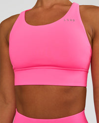 Woman wearing Accelerate Sports Bra - Sugar Plum | Set:true | Angle:closeup | Model:Brylee | Size:XS