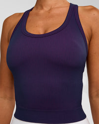 Woman wearing Activate Seamless Ribbed Shelf Bra Tank - Future Navy-Ultra Fuchsia | Model:Charli | Size:XS