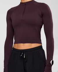 Woman wearing AeroFLX+ Long Sleeve Skimmer Half Zip - Midnight Plum/Midnight Plum | Model:Maja | Size:XS