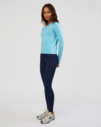 Woman wearing AeroFLX+ Seamless Long Sleeve Tee - Baltic Sea/Baltic Sea | Model:Dakota | Size:XS