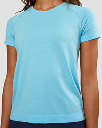 Woman wearing AeroFLX+ Seamless Tee - Baltic Sea/Baltic Sea | Model:Dakota | Size:XS