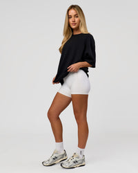 Woman wearing AfterDark ZeroCrease Boxy Tee in Black | Model:Issy | Size:XS