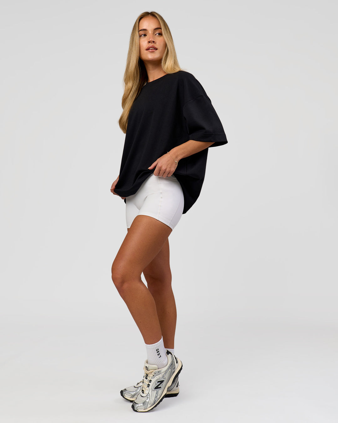 Woman wearing AfterDark ZeroCrease Boxy Tee in Black | Model:Issy | Size:XS