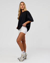 Woman wearing AfterDark ZeroCrease Boxy Tee in Black | Model:Issy | Size:XS