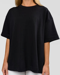 Woman wearing AfterDark ZeroCrease Boxy Tee in Black | Model:Issy | Size:XS
