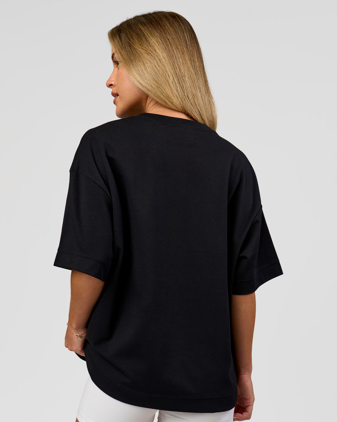 Woman wearing AfterDark ZeroCrease Boxy Tee in Black | Model:Issy | Size:XS