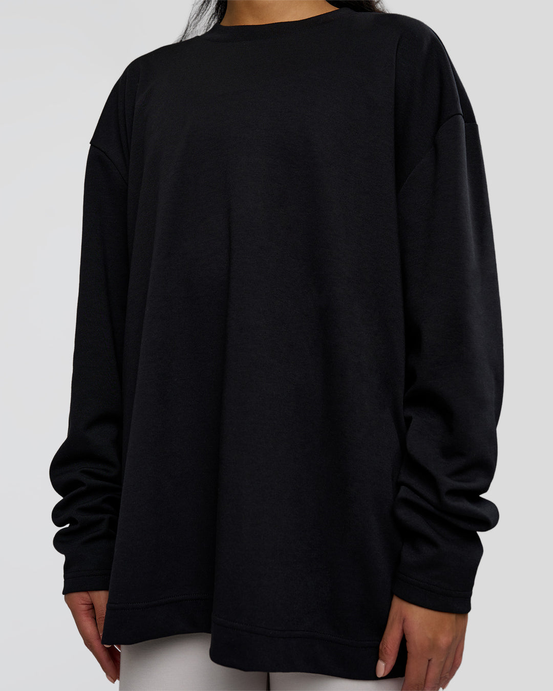 Woman wearing AfterDark ZeroCrease Long Sleeve Tee - Black | Model:Loren | Size:XS