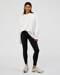 Woman wearing AfterDark ZeroCrease Long Sleeve Tee - White | Model:Loren | Size:XS