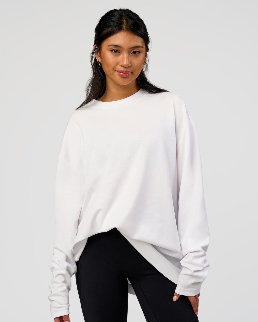 Woman wearing AfterDark ZeroCrease Long Sleeve Tee - White | Model:Loren | Size:XS