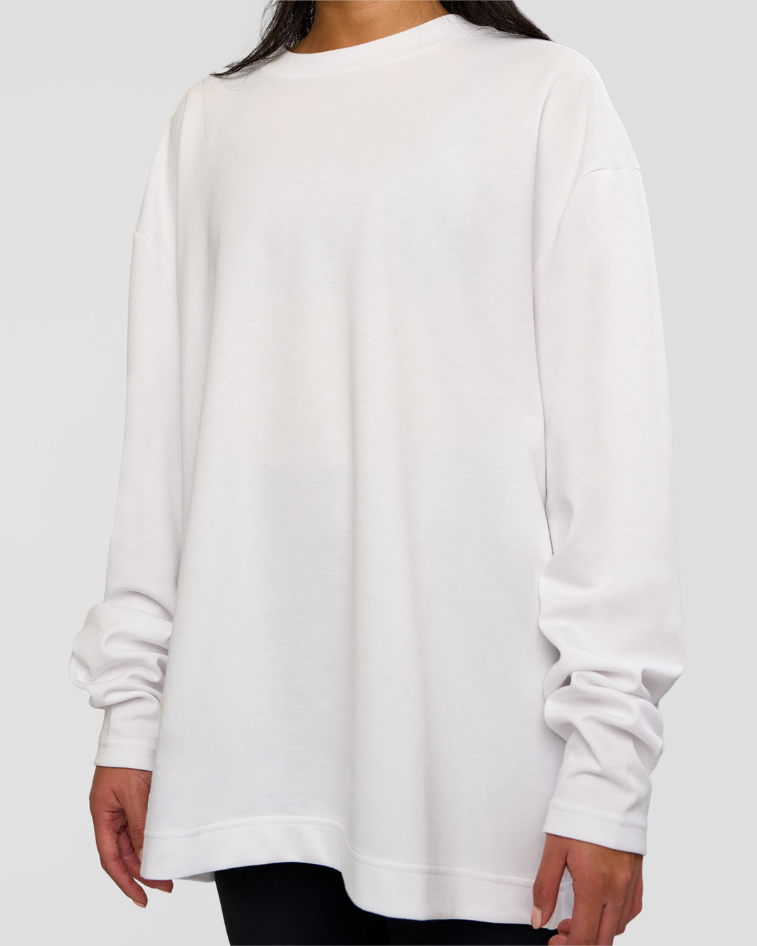 Woman wearing AfterDark ZeroCrease Long Sleeve Tee - White | Model:Loren | Size:XS