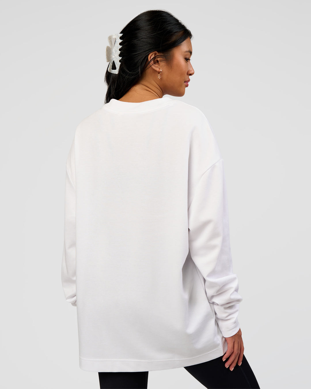 Woman wearing AfterDark ZeroCrease Long Sleeve Tee - White | Model:Loren | Size:XS