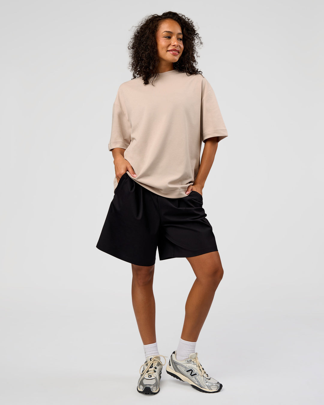 Woman wearing AfterDark ZeroCrease Oversized Tee - Shale Beige | Model:Jasmine | Size:XS