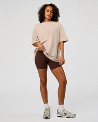 Woman wearing AfterDark ZeroCrease Oversized Tee - Shale Beige | Model:Jasmine | Size:XS
