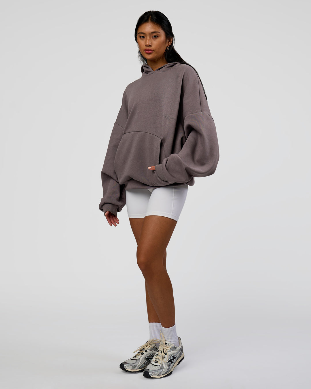 Woman wearing AfterDark ZeroCrease Oversized Hoodie - Duskstone | Model:Loren | Size:XS