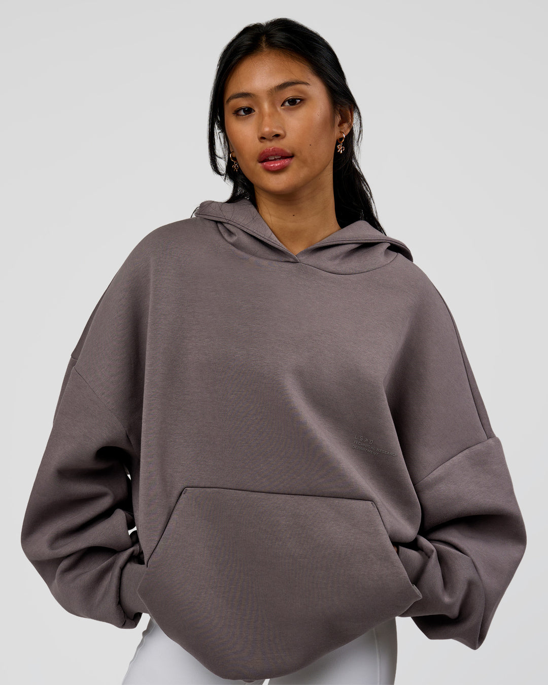Woman wearing AfterDark ZeroCrease Oversized Hoodie - Duskstone | Model:Loren | Size:XS