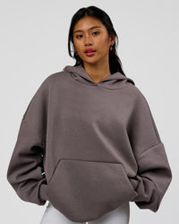 Woman wearing AfterDark ZeroCrease Oversized Hoodie - Duskstone | Model:Loren | Size:XS