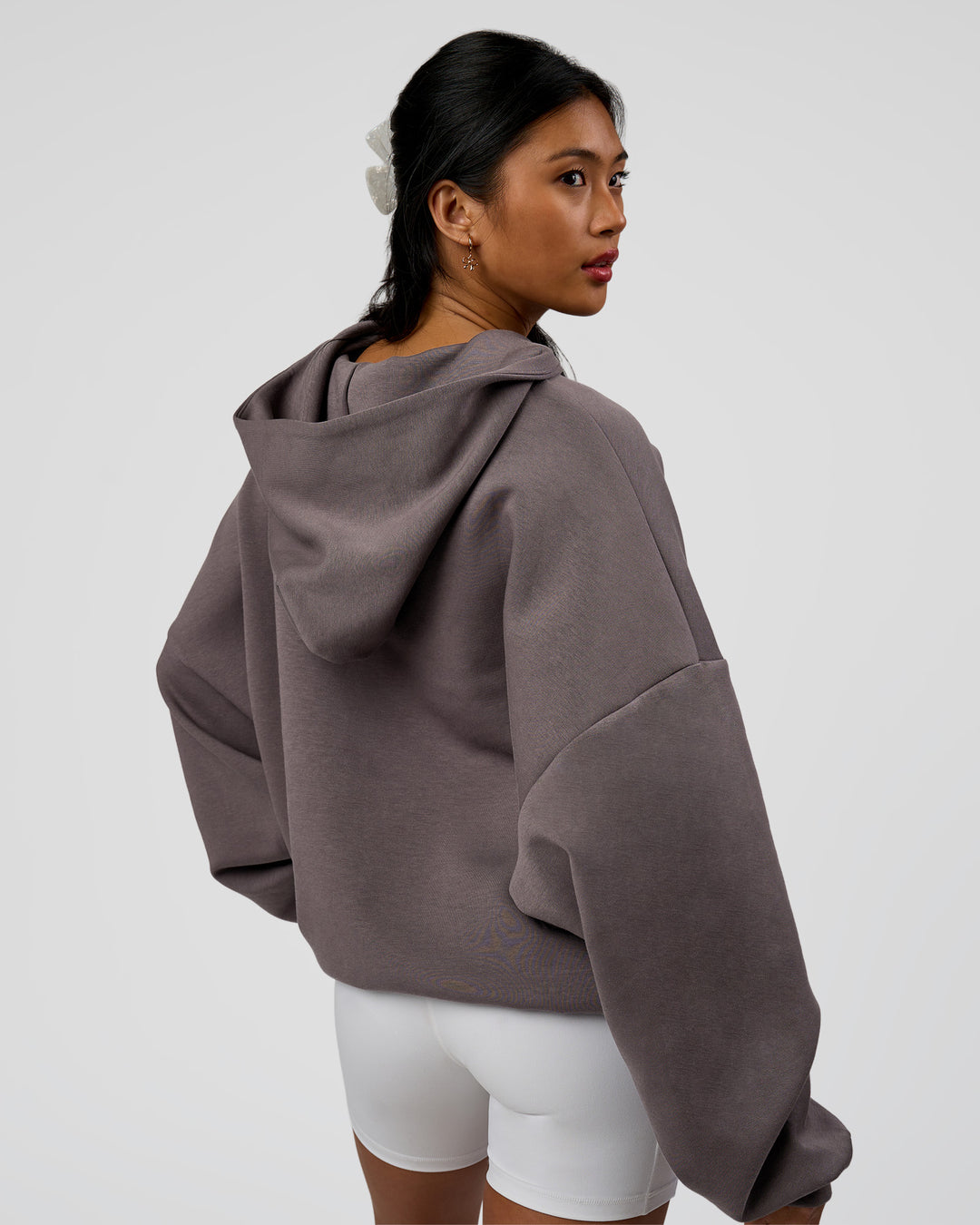 Woman wearing AfterDark ZeroCrease Oversized Hoodie - Duskstone | Model:Loren | Size:XS
