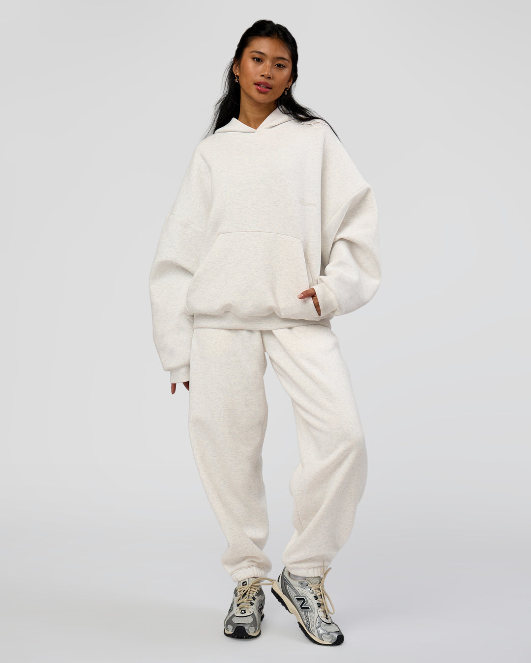 Woman wearing AfterDark ZeroCrease Oversized Hoodie - Silver Marl | Model:Loren |Size:XS