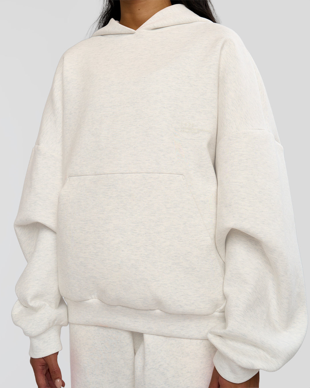 Woman wearing AfterDark ZeroCrease Oversized Hoodie - Silver Marl | Model:Loren |Size:XS
