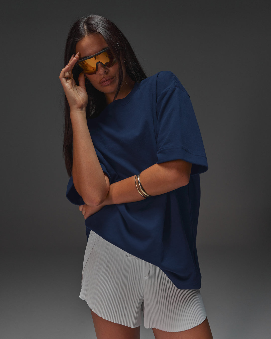 Woman wearing AfterDark ZeroCrease Oversized Tee - Future Navy | Model:Ruby | Size:XS