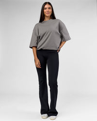 Woman wearing AfterDark ZeroCrease Oversized Tee - Storm Front | Model:Rhylee | Size:XS